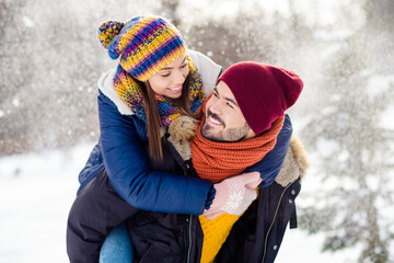 Photo of handsome guy hold on back adorable positive lady look each other have good mood free time...