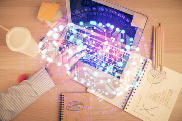 Double exposure of man's hands typing over computer keyboard and brain hologram drawing. Top view....