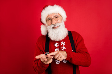 Photo of jolly holly santa happy positive smile count finger eve time celebration isolated over red color background