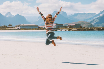 Jumping woman enjoying Norway landscape healthy lifestyle active vacations outdoor happy emotions...