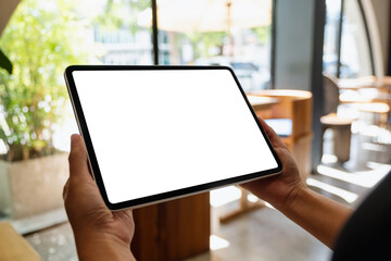 Mockup image of a woman holding digital tablet with blank white desktop screen - obrazy, fototapety, plakaty