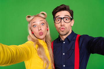 Photo of handsome flirty young guy lady wear pin up clothes sending you kiss recording self video isolated green color background