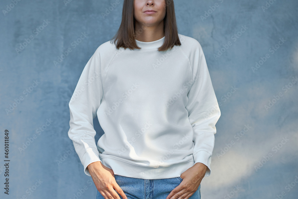 Wall mural Young woman in white blouse - Wall murals