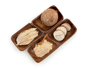 Pueraria mirifica or white kwao krua fruit ,slices and powder isolated on background.top view,flat lay.
