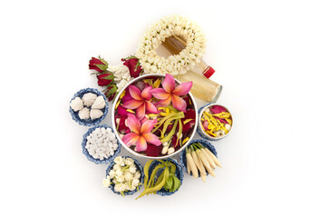 Jasmine garland and Colorful flower in water bowls decorating and scented water, perfume, marly limestone, pipe gun isolated on background for songkran festival or thai new year.
