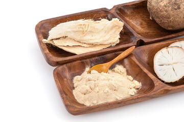 Pueraria mirifica or white kwao krua fruit ,slices and powder isolated on background.