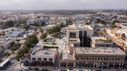 During a break in the fog, afternoon sunlight shines on the historic city center of downtown...