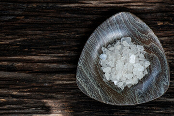 Borneol camphor ,crystal on an old wood and on nature background.