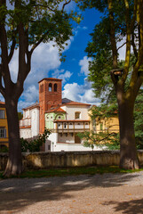 San Ponziano (St Pontianus) old church with medieval brick bell tower seen from Lucca walls public park