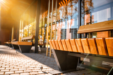 Stylish bus stop with wooden benches, modern architecture for the city