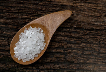 Saccharin or sweetener crystals on an old wood background.top view,flat lay.