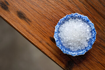 Saccharin or sweetener crystals on an old wood background.top view,flat lay.