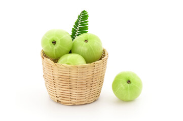 Indian Gooseberry or Phyllanthus emblica fruits and green leaves isolated on white background with clipping path.