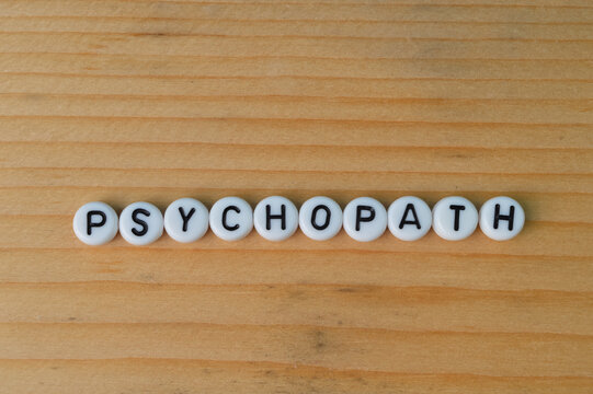 Alphabet beads with text PSYCHOPATH. Mental illness concept.