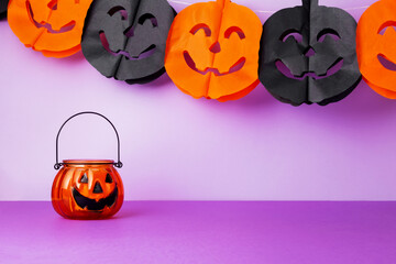 Halloween celebration. Pumpkins flashlight jack on  purple background