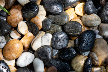 Water droplets on a multicolored stone.top view,flat lay.