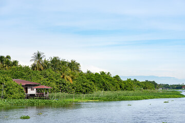 Waterfront house on nature background.