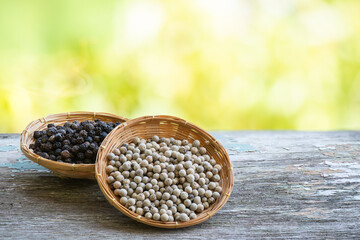 Black and white pepper on bokeh nature background.
