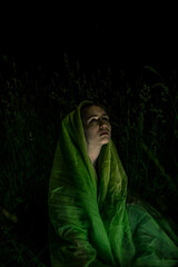 Saint Mary cosplay in green draping outdoors