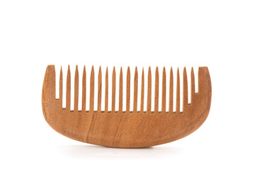 Wooden comb placed isolated on white background. - obrazy, fototapety, plakaty