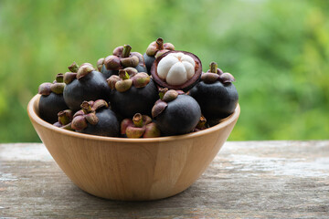 Mangosteen or garcinia mangostana fruits on nature background.