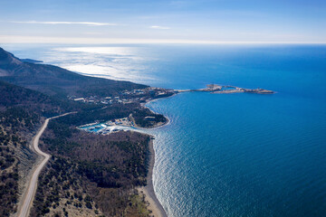 Fototapeta premium Aerial view of Bolshoy Utrish natural reserve and Black Sea coast on sunny winter day. Krasnodar Krai, Caucasus, Russia.