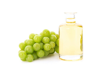 Grape fruits and oil isolated on white background.