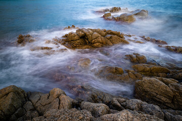 rocks in the middle of the sea with mist and silk effect, blanes catalonia spain