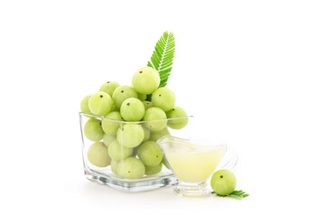 Indian Gooseberry fruits and juice isolated on white background.