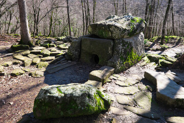 View of dolmen (2000 BC) in Zhane river gorge on sunny winter day. Krasnodar Krai, Russia.