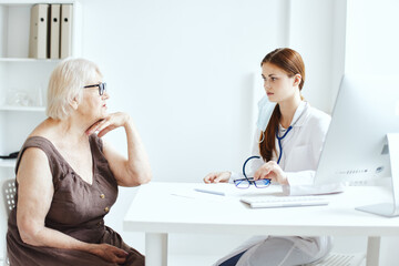 patient on examination by a nurse medical office