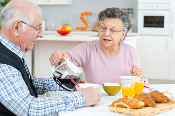 a senior couple having breakfast