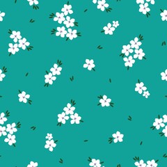 seamless vintage pattern.  bright blue background. white flowers. dark green leaves. vector texture. fashionable print for textiles and wallpaper.