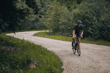 Caucasian man using black bike for outdoors training