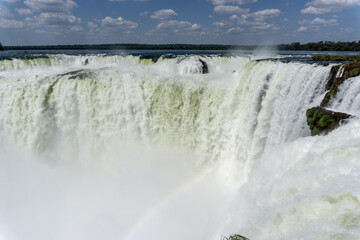 Fototapeta na wymiar Iguazu Falls, located on the border of Argentina and Brazil, is the largest waterfall in the world.