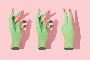 Halloween creative pattern with green witch hands with bright pink nails against pastel pink...