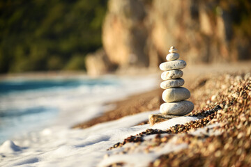 Pebble pyramid on the beach. 