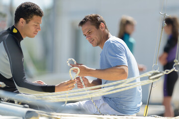 two men sailing a boat