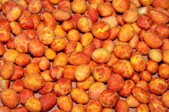 close - up on tijger nuts. A snack with double color (like tiger) and double coating on peanut with bacon and cheese aromas . selective focus