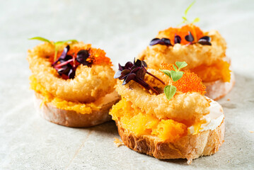 canape with fried calamari and caviar