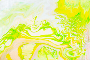 Fototapeta na wymiar Abstract yellow-green liquid background. Green paint pattern with cyclical swirls. Trendy wallpaper. Eco concept