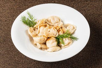 Homemade russian dumplings with meat, cheese and dill