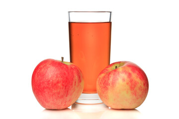 Glass of apple cider and two red apples isolated on white background.