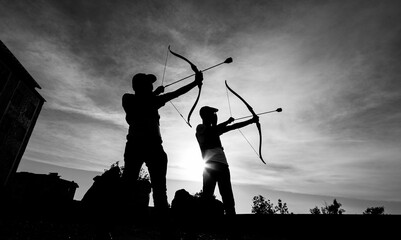 silhouettes of archers