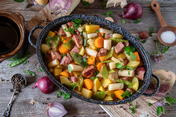 autumnal stew with vegetable and meat  made with root vegetables, black salsify, turnip, sugar...