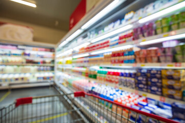 The defocused blur of drink milk food buying cart shopping put on a shelf at the drink.