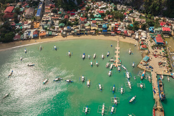 Aerial top view on the village of El Nido with many fisherman boats in Palawan Island, Philippines.