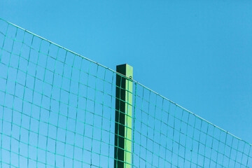 Texture of cradled metal or synthetic mesh on the fence for backgrounds