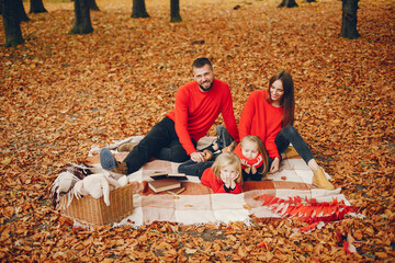 Family with cute kids in a autumn park