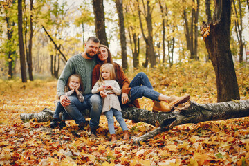 Family with cute kids in a autumn park